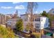 Exterior shot of the building featuring multiple windows, trees, and landscaping at 821 Ralph Mcgill Ne Blvd # 2303, Atlanta, GA 30306