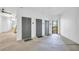 Hallway with gray doors, mats outside the doors, and light-colored walls in a shared living community at 821 Ralph Mcgill Ne Blvd # 2303, Atlanta, GA 30306