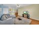 Cozy living room with a plush rug, sectional sofa, and TV at 821 Ralph Mcgill Ne Blvd # 2303, Atlanta, GA 30306