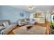 Spacious living room featuring a comfortable sectional sofa, natural light, and a seamless connection to the kitchen at 821 Ralph Mcgill Ne Blvd # 2303, Atlanta, GA 30306