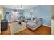 Comfortable living room with hardwood floors, a sectional sofa, and a large window providing ample natural light at 821 Ralph Mcgill Ne Blvd # 2303, Atlanta, GA 30306