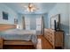 Bedroom featuring a bed, light hardwood floors, a dresser, curtains and ceiling fan at 821 Ralph Mcgill Ne Blvd # 2303, Atlanta, GA 30306