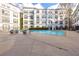 Community pool and deck area with lounge chairs and a water fountain feature at 821 Ralph Mcgill Ne Blvd # 2303, Atlanta, GA 30306