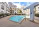 A refreshing community pool includes a modern architectural feature and plenty of space for residents at 821 Ralph Mcgill Ne Blvd # 2303, Atlanta, GA 30306