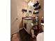 Well-lit bathroom featuring a vanity with storage and a large mirror at 710 River Run Dr, Atlanta, GA 30350
