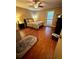 Spacious bedroom with hardwood floors and a ceiling fan at 710 River Run Dr, Atlanta, GA 30350