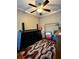Multi-purpose bedroom with dresser, storage, and ceiling fan at 710 River Run Dr, Atlanta, GA 30350