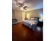 Main bedroom featuring hardwood floors and a ceiling fan at 710 River Run Dr, Atlanta, GA 30350