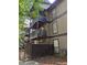 Multi-level building with private balconies and a fenced backyard at 710 River Run Dr, Atlanta, GA 30350
