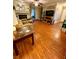 Living room with hardwood floors, fireplace, and plenty of natural light at 710 River Run Dr, Atlanta, GA 30350