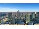 City skyline shot with clear blue skies showcases a dense arrangement of skyscrapers at 855 Peachtree Ne St # 1703, Atlanta, GA 30308