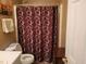 Clean bathroom with shower/tub combo and patterned curtain at 155 Vinnys Way, Covington, GA 30014