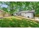 Private backyard with a deck and a large green lawn at 1507 Lively Ridge Ne Rd, Atlanta, GA 30329