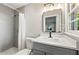 Modern bathroom with gray tile, a new vanity, and a walk-in shower at 1507 Lively Ridge Ne Rd, Atlanta, GA 30329