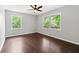 Spacious bedroom with hardwood floors and multiple windows at 1507 Lively Ridge Ne Rd, Atlanta, GA 30329