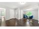 Bright dining area with glass table and blue chairs at 1507 Lively Ridge Ne Rd, Atlanta, GA 30329