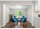 Cozy dining area with glass table and blue chairs at 1507 Lively Ridge Ne Rd, Atlanta, GA 30329