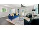 Spacious living room with blue sofa and French doors at 1507 Lively Ridge Ne Rd, Atlanta, GA 30329
