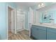 Spa-like bathroom with double vanity, shower, and light blue color scheme at 421 Brooch Way, Stockbridge, GA 30281