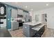 Modern kitchen with gray cabinets, stainless steel appliances, and island at 421 Brooch Way, Stockbridge, GA 30281