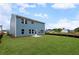 View of the home's exterior highlighting ample green space in the backyard at 126 Cherry Glen Way, Euharlee, GA 30145