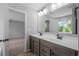 Bathroom featuring a double sink vanity, large mirror and neutral paint tones at 126 Cherry Glen Way, Euharlee, GA 30145