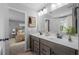 Bathroom with a double sink vanity and a view into a bedroom at 126 Cherry Glen Way, Euharlee, GA 30145