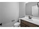 Clean half-bathroom featuring a stylish vanity, toilet, and dark fixtures at 126 Cherry Glen Way, Euharlee, GA 30145