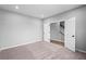 Bedroom features neutral-toned walls, plush carpeting, and an open doorway leading to other parts of the house at 126 Cherry Glen Way, Euharlee, GA 30145