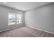 Bedroom boasts plush carpeting, neutral walls, and natural light streaming in from large windows at 126 Cherry Glen Way, Euharlee, GA 30145