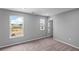 Bright bedroom with natural light, plush carpet, and views of the outdoors at 126 Cherry Glen Way, Euharlee, GA 30145