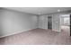 Bedroom featuring new carpet, a walk-in closet, and bright, neutral wall paint at 126 Cherry Glen Way, Euharlee, GA 30145