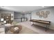 Open bonus room featuring a game table, comfortable seating, and modern decor at 126 Cherry Glen Way, Euharlee, GA 30145