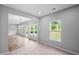 Open dining area with large windows and light colored carpet at 126 Cherry Glen Way, Euharlee, GA 30145