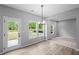 Bright dining area featuring a door to the outside and large windows at 126 Cherry Glen Way, Euharlee, GA 30145