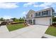 Charming two-story home with a two-car garage and well-maintained lawn situated in a residential area at 126 Cherry Glen Way, Euharlee, GA 30145