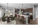 Modern kitchen featuring a central island with bar stool seating and stainless steel appliances at 126 Cherry Glen Way, Euharlee, GA 30145
