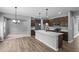Modern kitchen with stainless steel appliances, an island, and hardwood flooring at 126 Cherry Glen Way, Euharlee, GA 30145