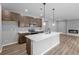 Modern kitchen with an island, sleek countertops, and stainless steel appliances at 126 Cherry Glen Way, Euharlee, GA 30145