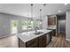 Open kitchen with a large island, stainless steel dishwasher, and modern fixtures at 126 Cherry Glen Way, Euharlee, GA 30145
