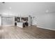 Spacious living room featuring modern wood floors and an open concept kitchen at 126 Cherry Glen Way, Euharlee, GA 30145