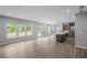 Bright and open living room with large windows and wood floors at 126 Cherry Glen Way, Euharlee, GA 30145