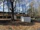 Backyard with sheds and wooded area at 3965 Pecan Rd, Loganville, GA 30052
