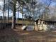 Backyard with damaged sheds and debris at 3965 Pecan Rd, Loganville, GA 30052