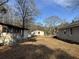 Backyard view of multiple houses and sheds at 3965 Pecan Rd, Loganville, GA 30052
