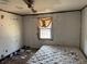Bedroom needs renovation, includes a mattress and window at 3965 Pecan Rd, Loganville, GA 30052