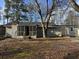 Ranch home with screened porch and mature trees at 3965 Pecan Rd, Loganville, GA 30052