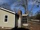 Side view of tan house exterior with screen porch at 3965 Pecan Rd, Loganville, GA 30052