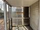 Interior view of the weathered screened porch at 3965 Pecan Rd, Loganville, GA 30052
