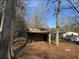 Rustic wooden shed with tires inside at 3965 Pecan Rd, Loganville, GA 30052